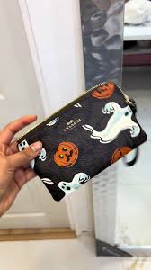 COACH muñequera | Wristlet